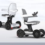 a couple of white and black mobility scooters